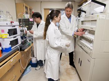 Craik with student in lab