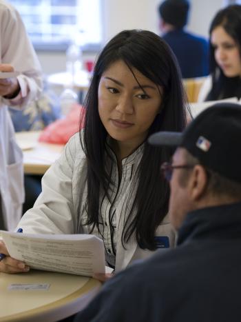 student pharmacist with patient